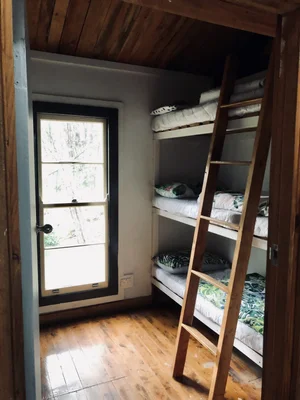 Triple bunks within shared cabin - Image 2